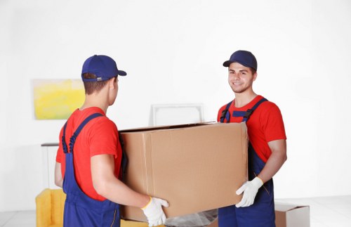 Professional movers handling office furniture during a Westminster relocation