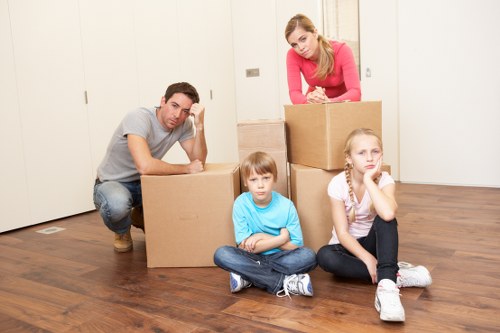 Packing belongings into a storage container at a central London property